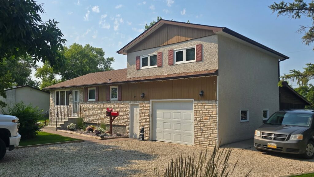 Shingle roof replacement on a split-level home in Winnipeg — Trudel Roofing